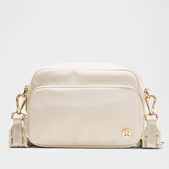 Lululemon Everywhere Crossbody Bag 2L L Monogram Metallic in Light Ivory/Gold Lululemon Everywhere Crossbody Bag 2L L Monogram Metallic in Light Ivory/Gold